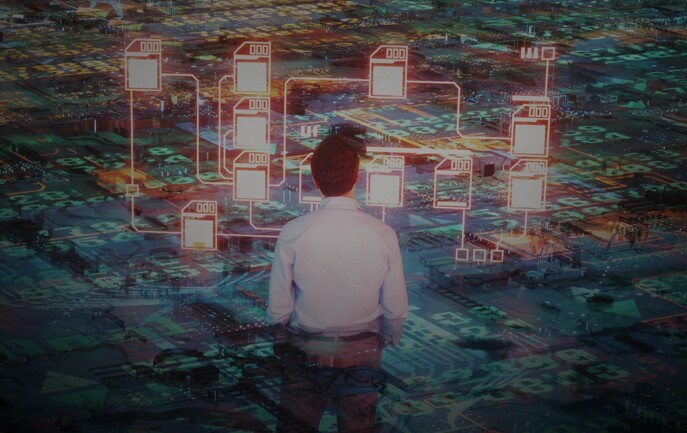 A man standing in front of a digital city