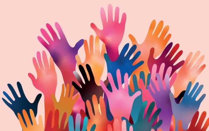 A group of colorful hands are raised up on a pink background
