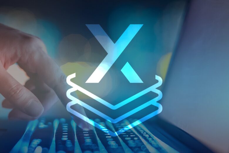 A person typing on a laptop with the x logo